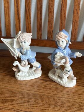 Not Rated Blue and Cream Porcelain Boy and Girl Figurine Set